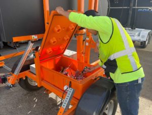 Man Repairing and Installing Traffic Signs