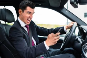 Man Driving And Texting