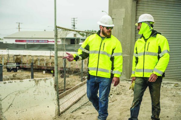 Two Man Working Wearing Protective Vest