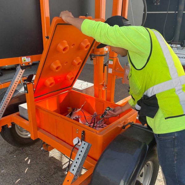 Man Repairing and Installing Traffic Signs