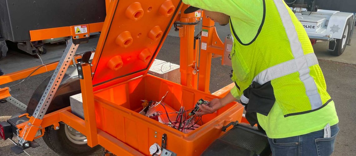 Man Repairing and Installing Traffic Signs