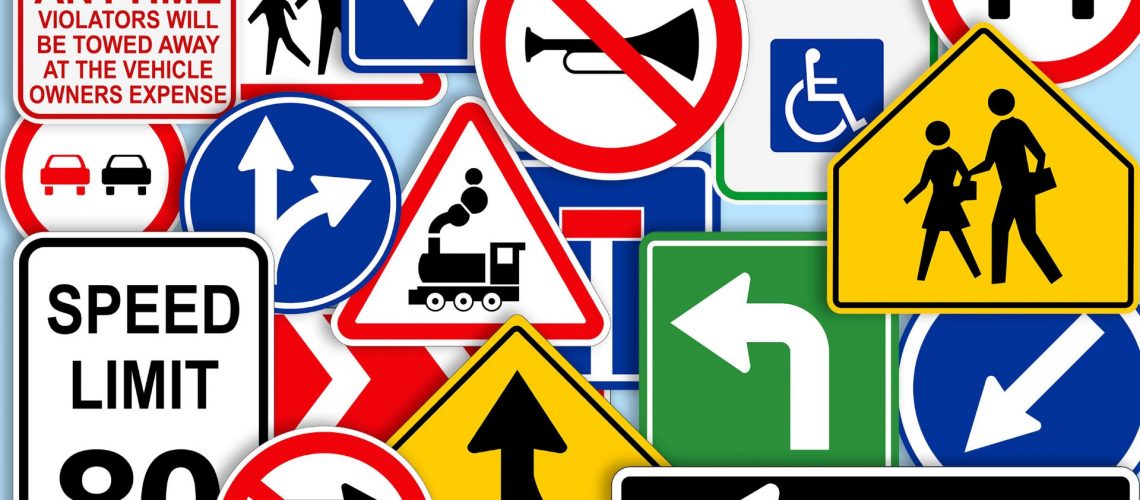 lots of different traffic signs all together