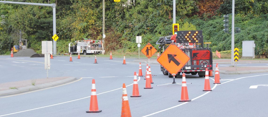 traffic cones and road work signage on road