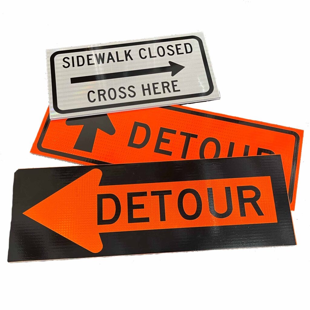 bright orange road signs laid out