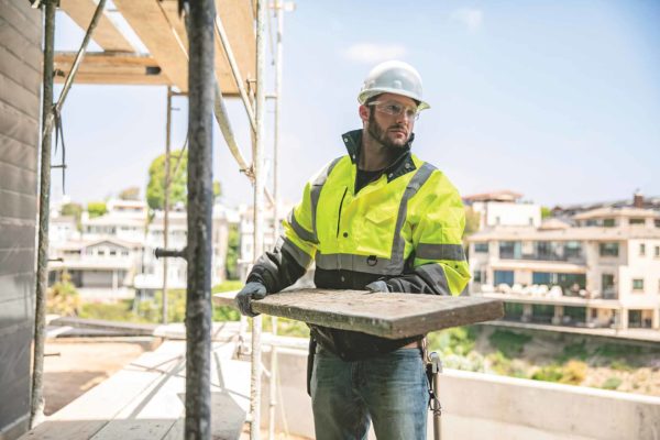 Young Man Wearing Protective Vest While Working