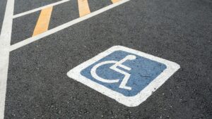 road stencil of handicap sign on parking space