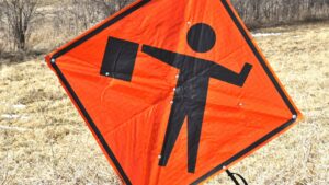 flagger ahead roll up road sign