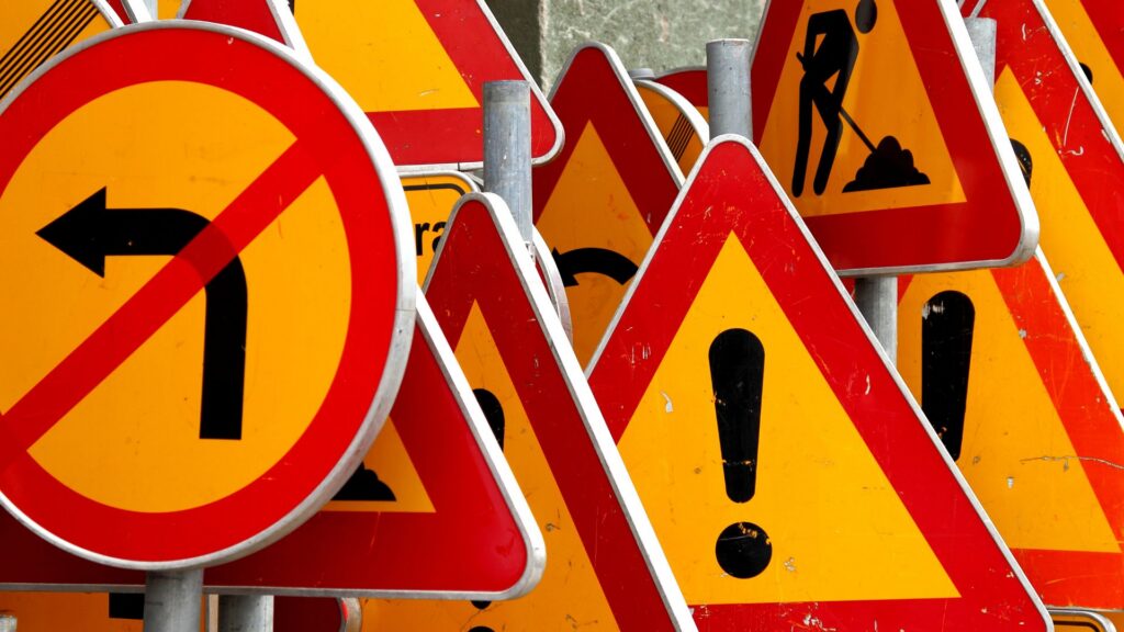 red and orange traffic warning signs