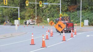 traffic cones and road work signage on road