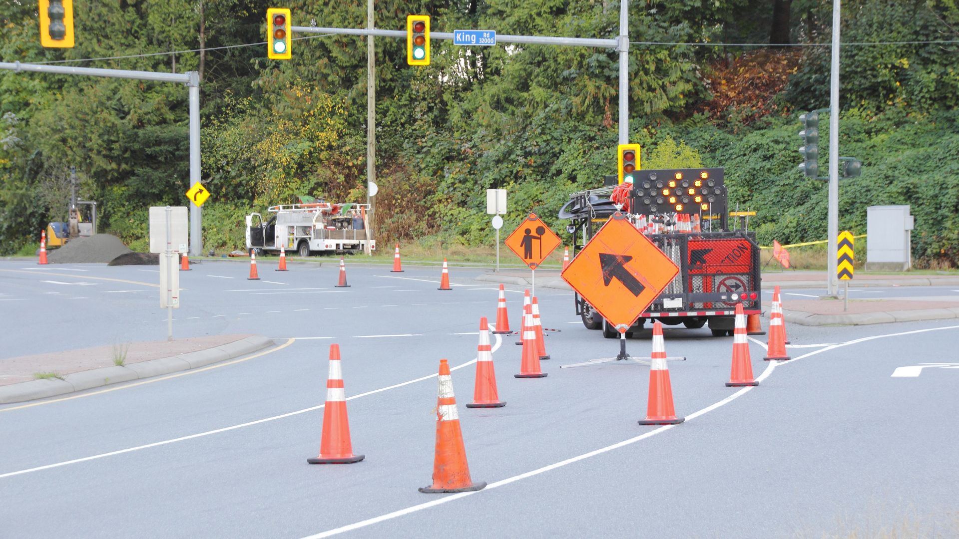 traffic cones and road work signage on road
