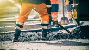 man working on road work in summer