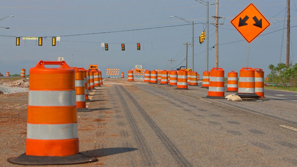 traffic cones all over road with construction