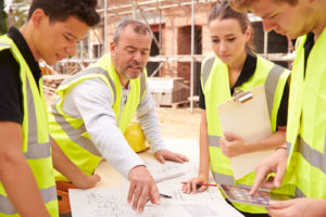 Construction Workers reviewing traffic control plans